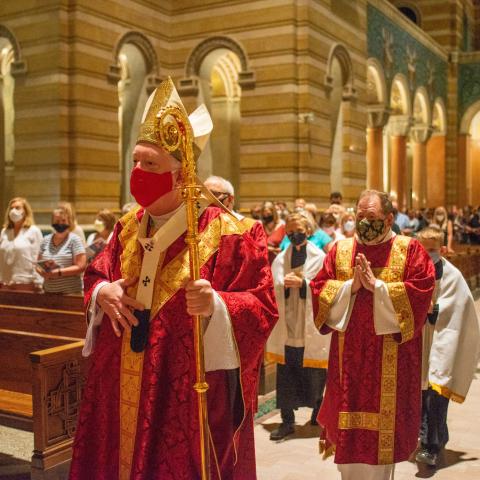 Archbishop Rozanski processes down the Cathedral Basilica aisle to celebrate the Mass of Catechetical Commissioning. Photo Credit: Katherine Blanner