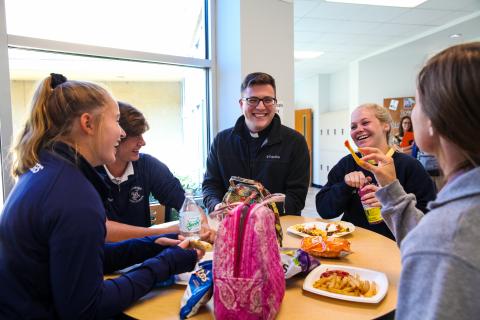 High school students with priest