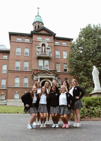 group of students standing in front of Notre Dame High School