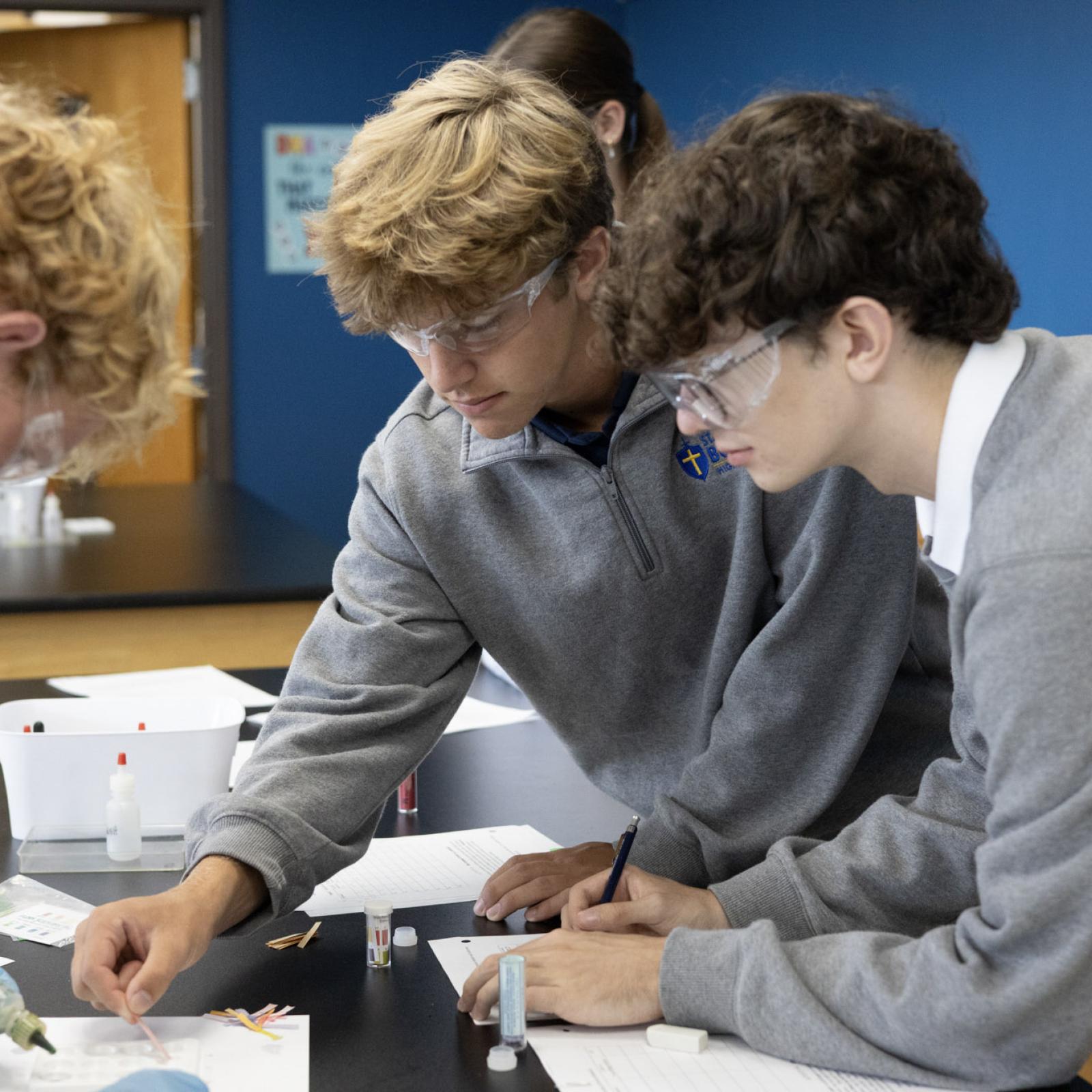 Three students working on a group activity